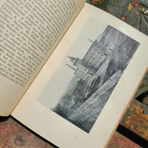 May include: A black and white photograph of a large brick building with a tall smokestack. The building is surrounded by trees and a fence. The text "Arlington Mills, 1867" is printed in the bottom right corner of the image.
