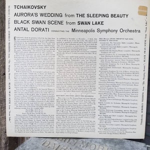 May include: A black and white record album cover featuring a photo of conductor Antal Dorati. The album title is "Tchaikovsky: Aurora's Wedding from The Sleeping Beauty; Black Swan Scene from Swan Lake". The album is conducted by Antal Dorati and performed by the Minneapolis Symphony Orchestra.