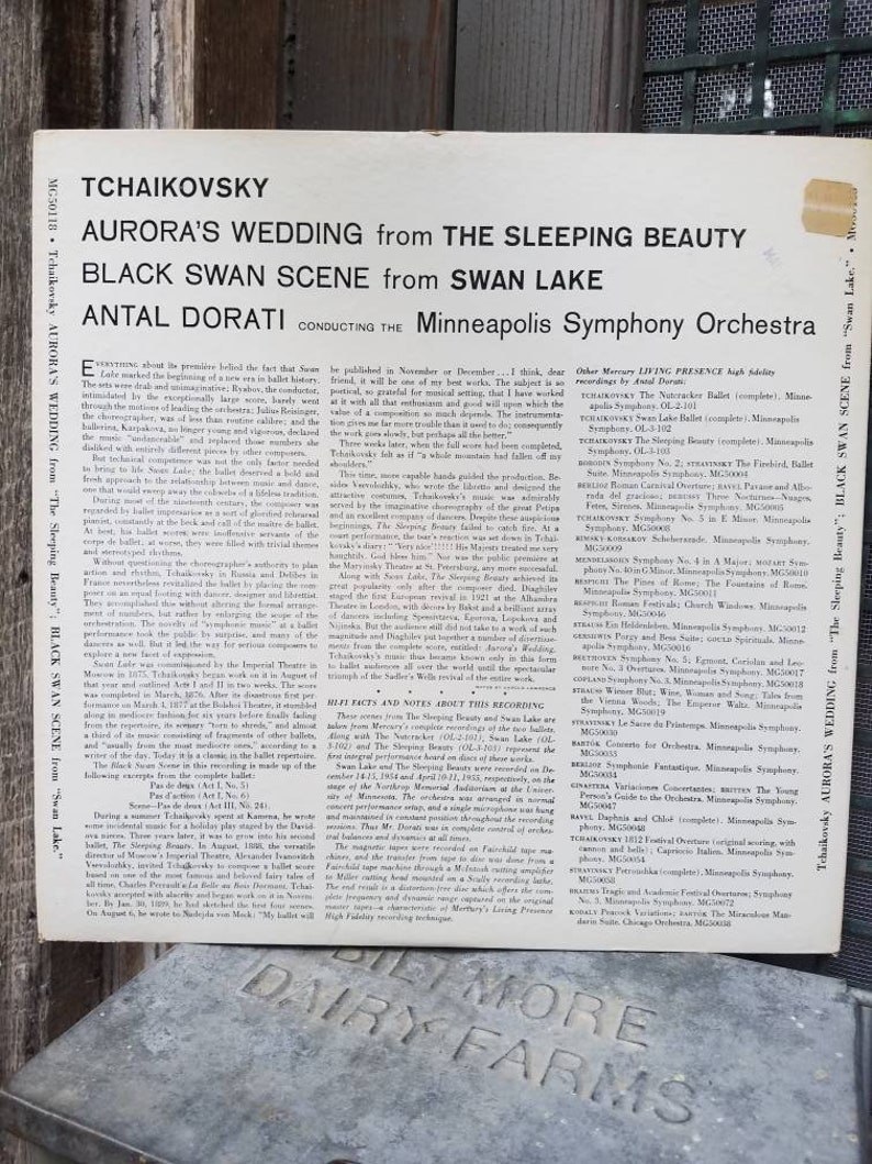 May include: A black and white record album cover featuring a photo of conductor Antal Dorati. The album title is "Tchaikovsky: Aurora's Wedding from The Sleeping Beauty; Black Swan Scene from Swan Lake". The album is conducted by Antal Dorati and performed by the Minneapolis Symphony Orchestra.