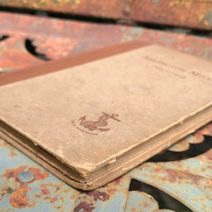 May include: A vintage book titled "Southern Miles" with a brown cover and an anchor symbol on the front.