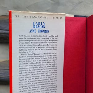 May include: A hardcover book titled "Early Reagan" by Anne Edwards. The book's spine is red with white text, and the interior pages are red. The book's text describes the early life of Ronald Reagan.