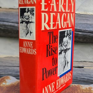 May include: A hardcover book titled "Early Reagan" by Anne Edwards. The cover is red with white lettering and a black and white photo of a person. The book's title is prominently displayed.