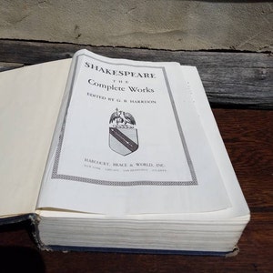 May include: A white book with the title "Shakespeare The Complete Works" and the publisher "Harcourt, Brace & World, Inc."