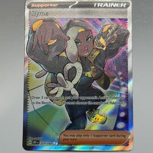 May include: A Pokemon trading card featuring Ryme, a supporter card from the Sword & Shield - Brilliant Stars set. The card is holographic and features a colorful illustration of Ryme with a microphone. The card text reads: "Draw 3 cards. Switch out your opponent's Active Pokemon to the Bench. (Your opponent chooses the new Active Pokemon.) You may play only 1 Supporter card during your turn."