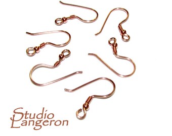 May include: Six copper-colored earring hooks with a small ball at the top of each hook.