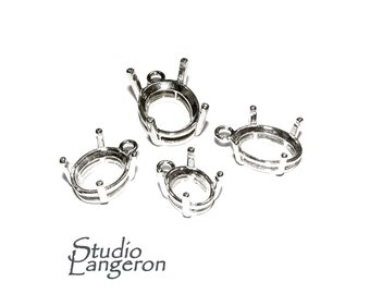 May include: Four silver oval-shaped pendant settings with prongs. The settings are different sizes and have a loop at the top for attaching a chain.