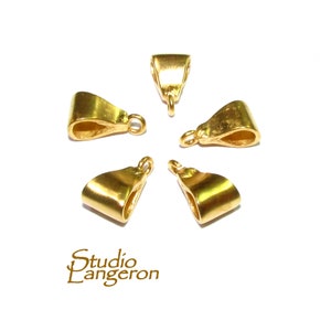 May include: Five gold-toned metal pendant bails, each with a slightly different shape, arranged in a circle on a white background.