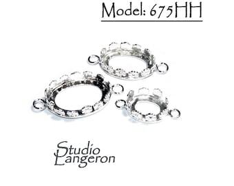 May include: Three silver oval-shaped bezel settings with a decorative edge. The bezels have two jump rings on each side. Model: 675HH