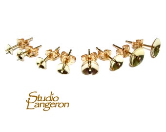 May include: Six gold-toned earring posts with round backs. The posts are designed for attaching earrings.