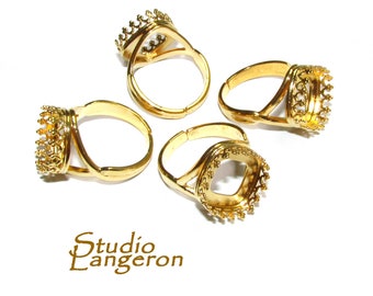 May include: Four gold-tone adjustable rings with a crown-shaped bezel setting. The rings are designed to hold a cabochon stone.
