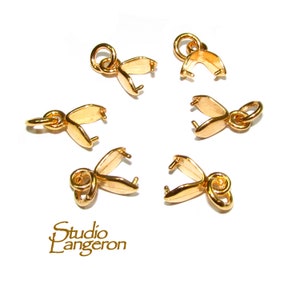 May include: Six gold-toned metal pendant clasps with a loop at the top and a pair of prongs at the bottom. The clasps are designed to hold a pendant or charm.