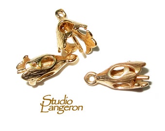 May include: Three gold-toned metal pendant caps with an ornate design. The caps are designed to hold a pendant or charm.