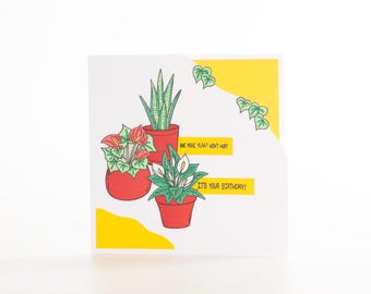 May include: A birthday card featuring three potted plants in red pots. The card has yellow accents and the text "ONE MORE PLANT WON'T HURT" and "IT'S YOUR BIRTHDAY!" in black.