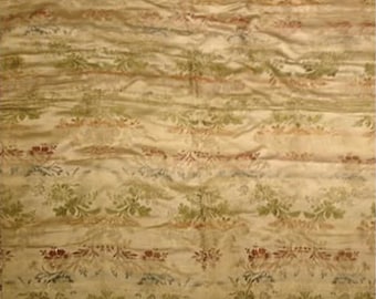 May include: Cream-colored fabric with a floral pattern in shades of green, red, and blue. The fabric has a textured appearance with horizontal stripes and a subtle sheen. The floral design is repeated throughout the fabric.