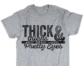 Muslos gruesos y camisa de lindos ojos. Tipografía. Camiseta divertida. Arriba. Unisex.