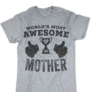 May include: Gray t-shirt with the text "World's Most Awesome Mother" in black with a trophy and thumbs up graphic.