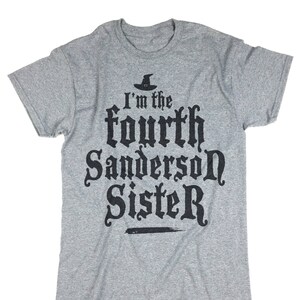 May include: Gray t-shirt with black text that reads "I'm the fourth Sanderson Sister" with a witch's hat graphic above the text.
