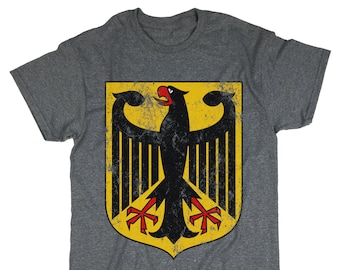 May include: A heather grey t-shirt with a distressed black and yellow German eagle crest.