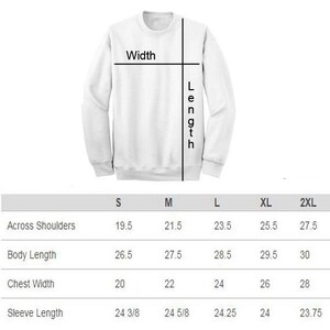 May include: Size chart for a sweatshirt with measurements in inches for across shoulders, body length, chest width, and sleeve length. Sizes include S, M, L, XL, and 2XL.