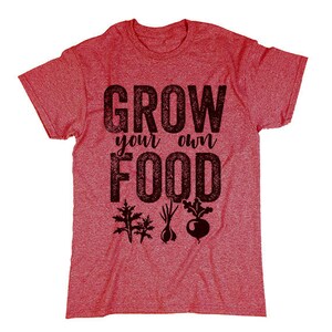 May include: Red t-shirt with the text "Grow your own food" in black lettering. The text has a distressed look. There are three small black and white illustrations of vegetables below the text.