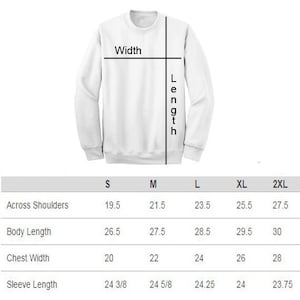 May include: Size chart for a sweatshirt with measurements in inches for across shoulders, body length, chest width, and sleeve length. Sizes include S, M, L, XL, and 2XL.