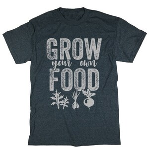 May include: A dark blue t-shirt with the text "Grow your own food" in white, distressed lettering. The shirt features a graphic of three different plants in white.