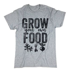 May include: Gray t-shirt with the text "Grow your own food" in black with a distressed look. The text is surrounded by small black graphic images of plants.