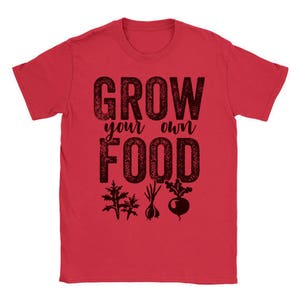 May include: Red t-shirt with the text "Grow your own food" in black with a distressed look. The text is surrounded by images of plants and vegetables.