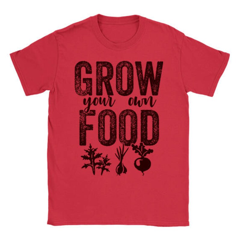 May include: Red t-shirt with the text "Grow your own food" in black with a distressed look. The text is surrounded by images of plants and vegetables.