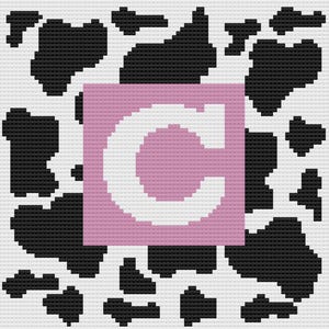 May include: A white letter C on a pink background with a black and white cow print pattern.
