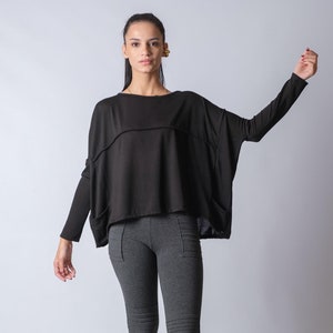 Oversized off shoulder knit top for women in soft winter fabric, loose fit long sleeve slouchy blouse