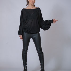 Soft oversized blouse, casual streetwear with batwing sleeves.