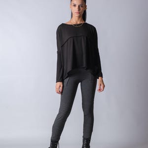 Casual oversized knit blouse for women with draped neckline and comfortable tunic length