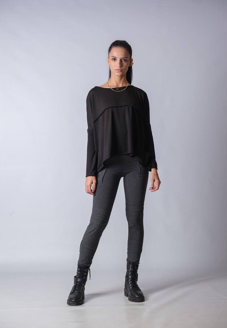 Casual oversized knit blouse for women with draped neckline and comfortable tunic length