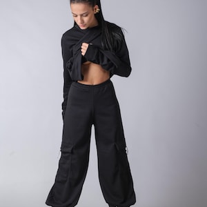 Women’s techwear-inspired baggy pants with adjustable elastic waist and cozy fabric