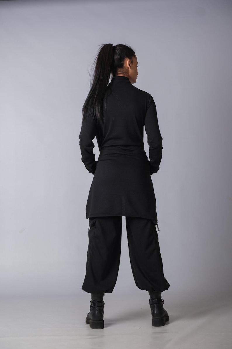 Soft black cotton sweatpants with loose fit and functional cargo pockets