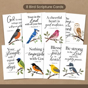 May include: A set of eight white rectangular scripture cards featuring colorful bird illustrations and black text. Each card displays a unique bird perched on a branch alongside a Bible verse, including quotes like God is our refuge and strength.
