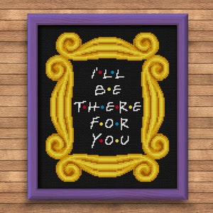 May include: A black and gold cross-stitch pattern featuring the iconic "Friends" TV show frame with the phrase "I'll be there for you" in colorful letters.