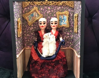 Conjoined twins taxidermy art. Freakshow conjoined Siamese twins in carnival sideshow w/ mice