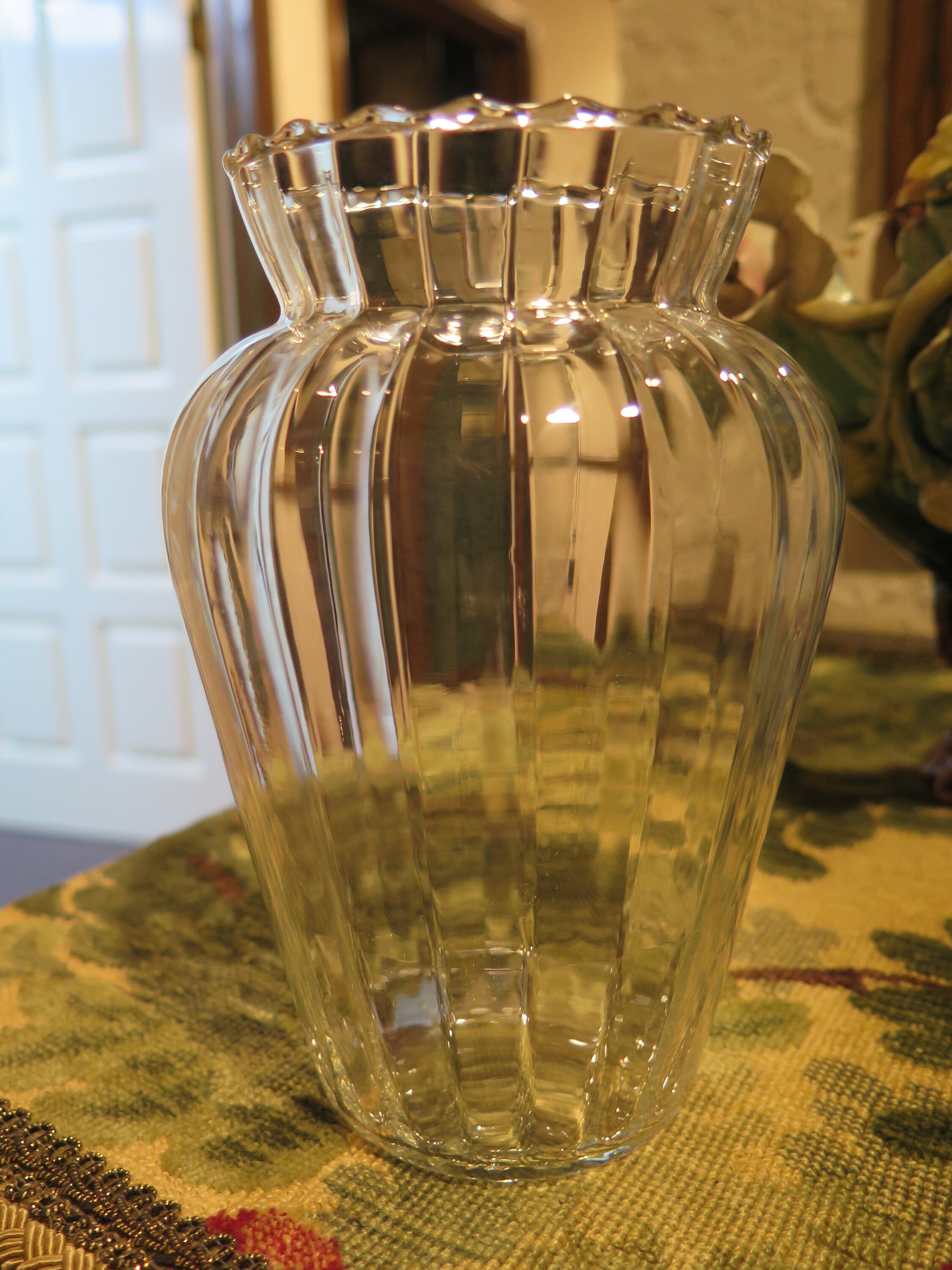 elegant and slim with frilled edges at the top of the vase. Pretty bud vase elegant and slim with frilled edges at the top of the vase. Pretty bud vase