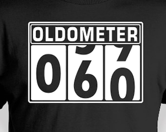 May include: Black t-shirt with a white graphic of an odometer reading "060".
