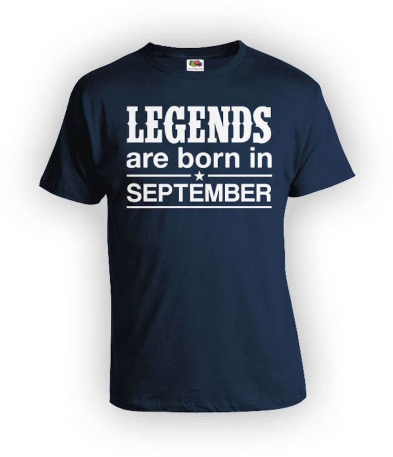 May include: A navy blue t-shirt with white text that reads "LEGENDS are born in SEPTEMBER".