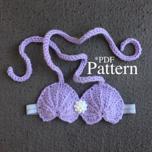 May include: A purple crocheted seashell bra with a white pearl embellishment. *PDF Pattern* is written on the image.