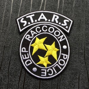 R.P.D. Raccoon City S.T.A.R.S Iron on Embroidered Patch in Black. Available in Sizes Small (60mm x 45mm) and Large (100mm x 85mm).