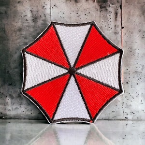 Umbrella Corporation Logo Iron on Patch. Available in Sizes Small (60mm Diameter) and Large (80mm Diameter)