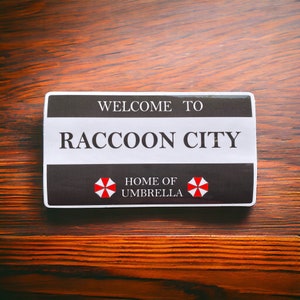 Welcome to Raccoon City Black Waterproof and UV resistant PVC sticker. Size 100mm x 55mm