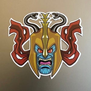 Mumm-Ra Evil Bad Guy Villain Fun Cartoon Sticker. Waterproof and UV resistant PVC sticker. Size 95mm x 90mm Diameter.