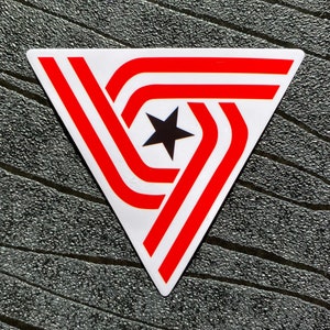 May include: A red and white triangle with a black star in the center. The triangle has three stripes that are red and white.