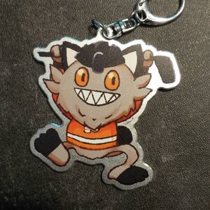 2.5in Hockey Meowth Double Sided Aluminum Keychain