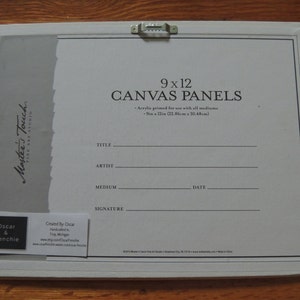 May include: A rectangular canvas panel, measuring 9 x 12 inches, with a white border and a metal hanger. The text "9 x 12 CANVAS PANELS" is printed on the canvas. Additional text includes "Master's Touch FINE ART STUDIO" and artist information.